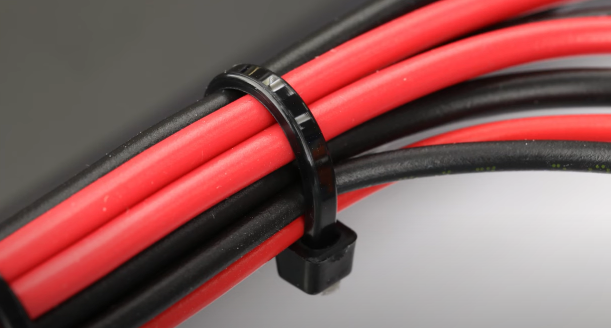 Several cables covered by a zip tie