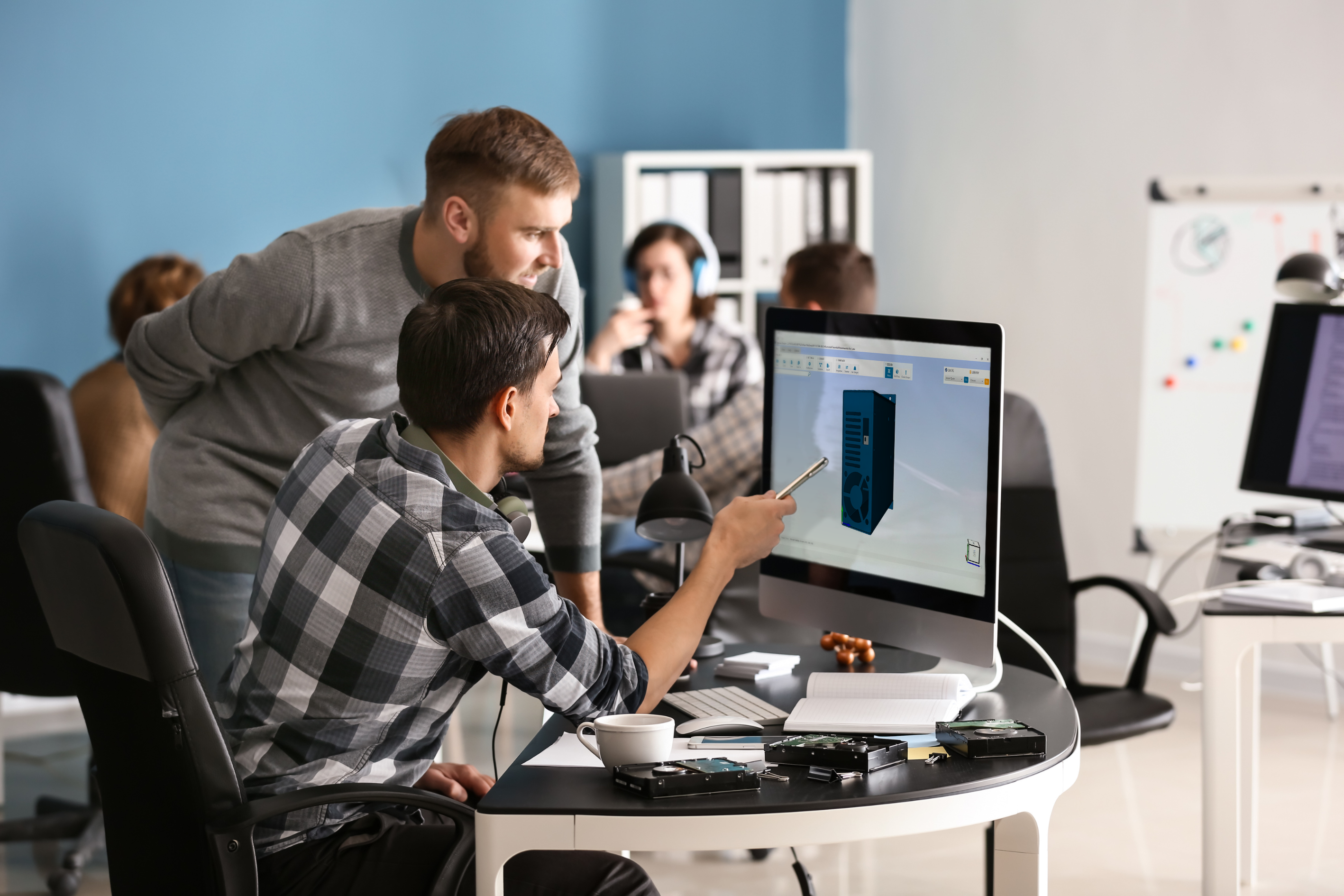 Two engineers working together on Protocase Designer Enterprise